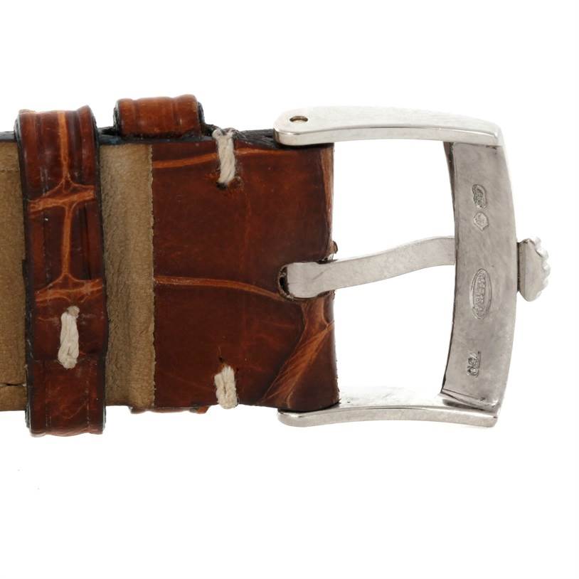 This image shows a close-up of the clasp and brown leather strap of a Rolex Cellini 4233 Men's White Gold White Dial 4233 Men's White Gold White Dial watch.