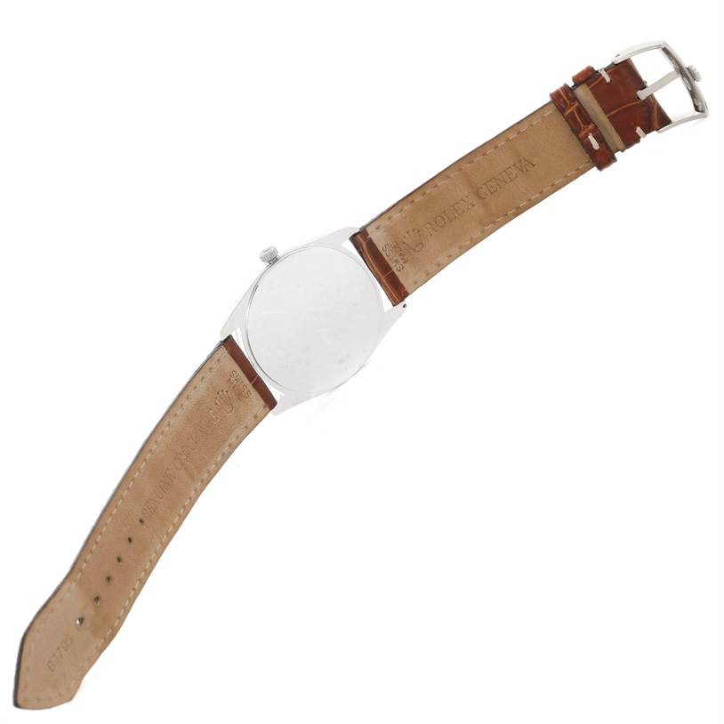 The image shows the back and side view of a Rolex Cellini 4233 Men's White Gold White Dial 4233 Men's White Gold White Dial watch, featuring its leather strap and buckle.