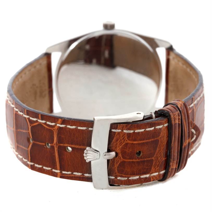 The image shows the back of a Rolex Cellini 4233 Men's White Gold White Dial 4233 Men's White Gold White Dial watch with a brown leather strap and silver buckle.