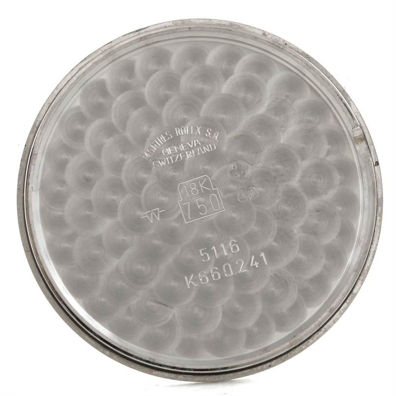 This is the inside view of the case back of a Rolex Cellini 5116 Men's White Gold Grey Dial 5116 Men's White Gold Grey Dial watch, showing engravings and hallmarks.