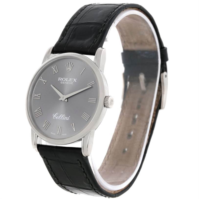 The image shows a Rolex Cellini 5116 Men's White Gold Grey Dial 5116 Men's White Gold Grey Dial watch from a slight front-side angle, highlighting its dial, crown, and leather strap.