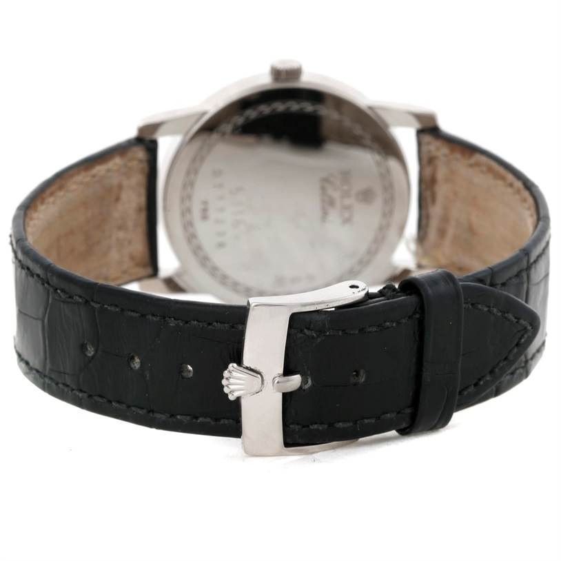 This image shows the back view of a Rolex Cellini 5116 Men's White Gold Grey Dial 5116 Men's White Gold Grey Dial watch, highlighting its metal case back and black leather strap with a buckle.