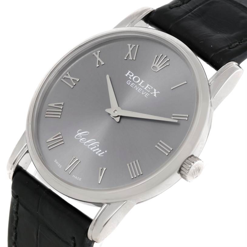The image showcases a Rolex Cellini 5116 Men's White Gold Grey Dial 5116 Men's White Gold Grey Dial watch angled slightly from the top right, highlighting the dial, bezel, lugs, crown, and black leather strap.