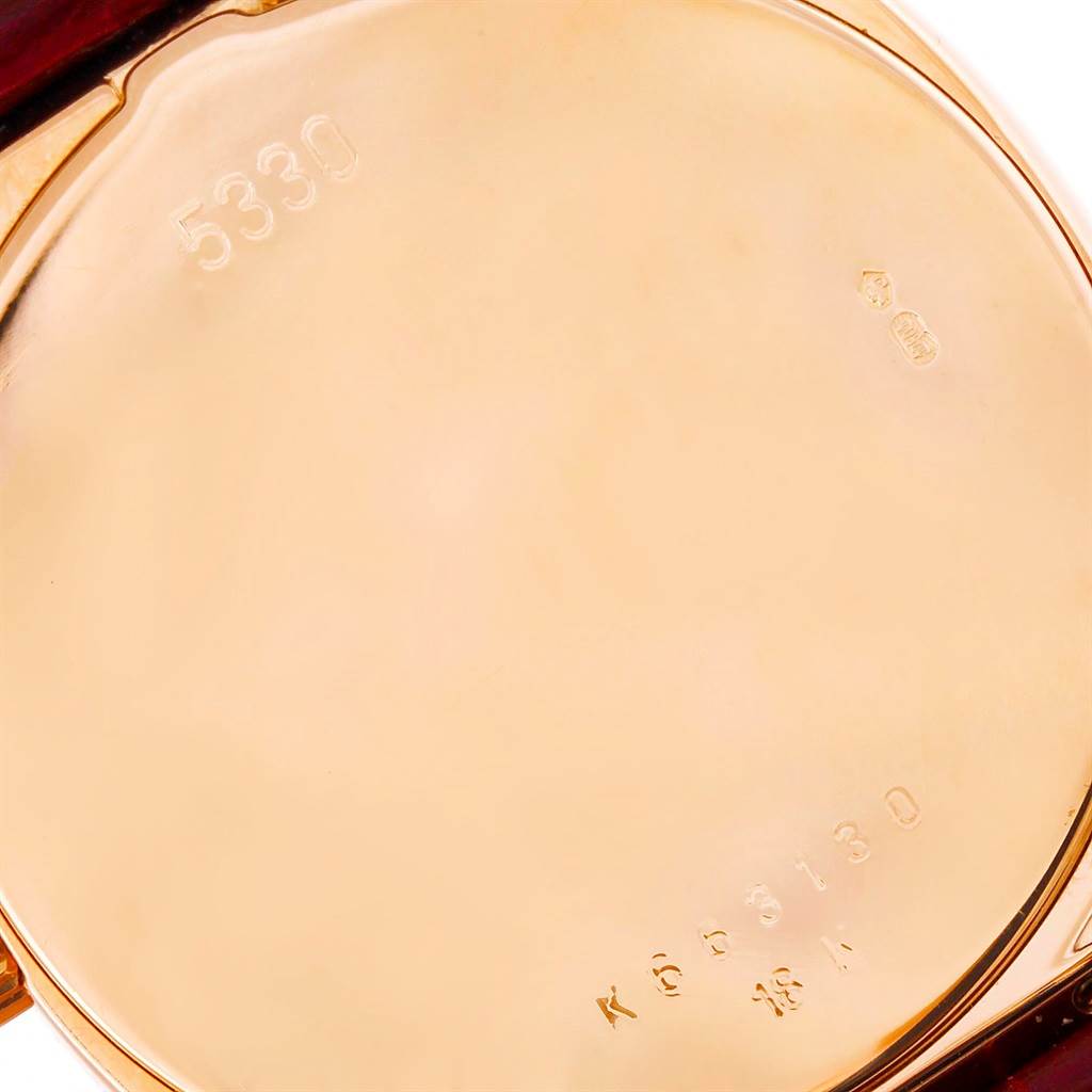 This image shows the back case of a Rolex Cellini 5330 Men's Rose Gold White Dial 5330 Men's Rose Gold White Dial watch, viewed directly from behind, displaying model and hallmark engravings.