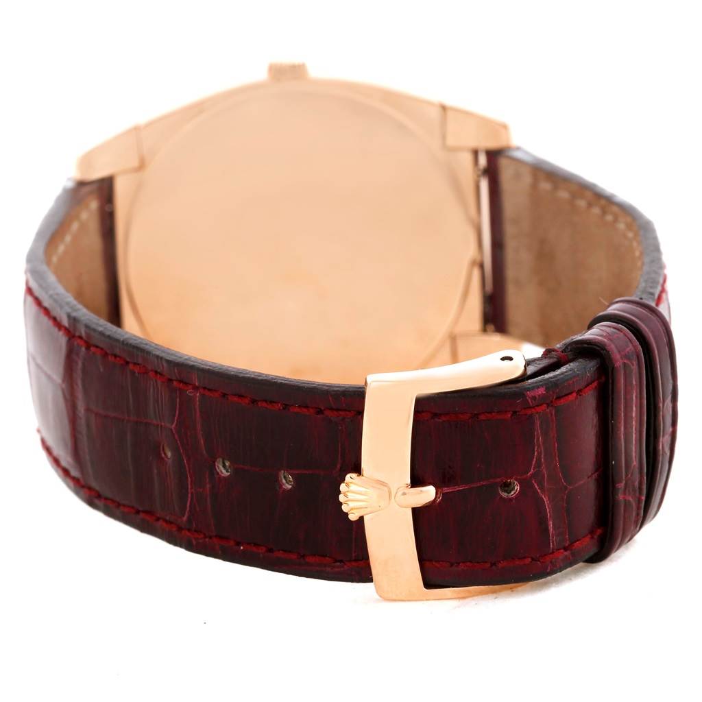 The image shows the back of the Rolex Cellini 5330 Men's Rose Gold White Dial 5330 Men's Rose Gold White Dial watch, featuring its leather strap and gold buckle with the Rolex crown logo.