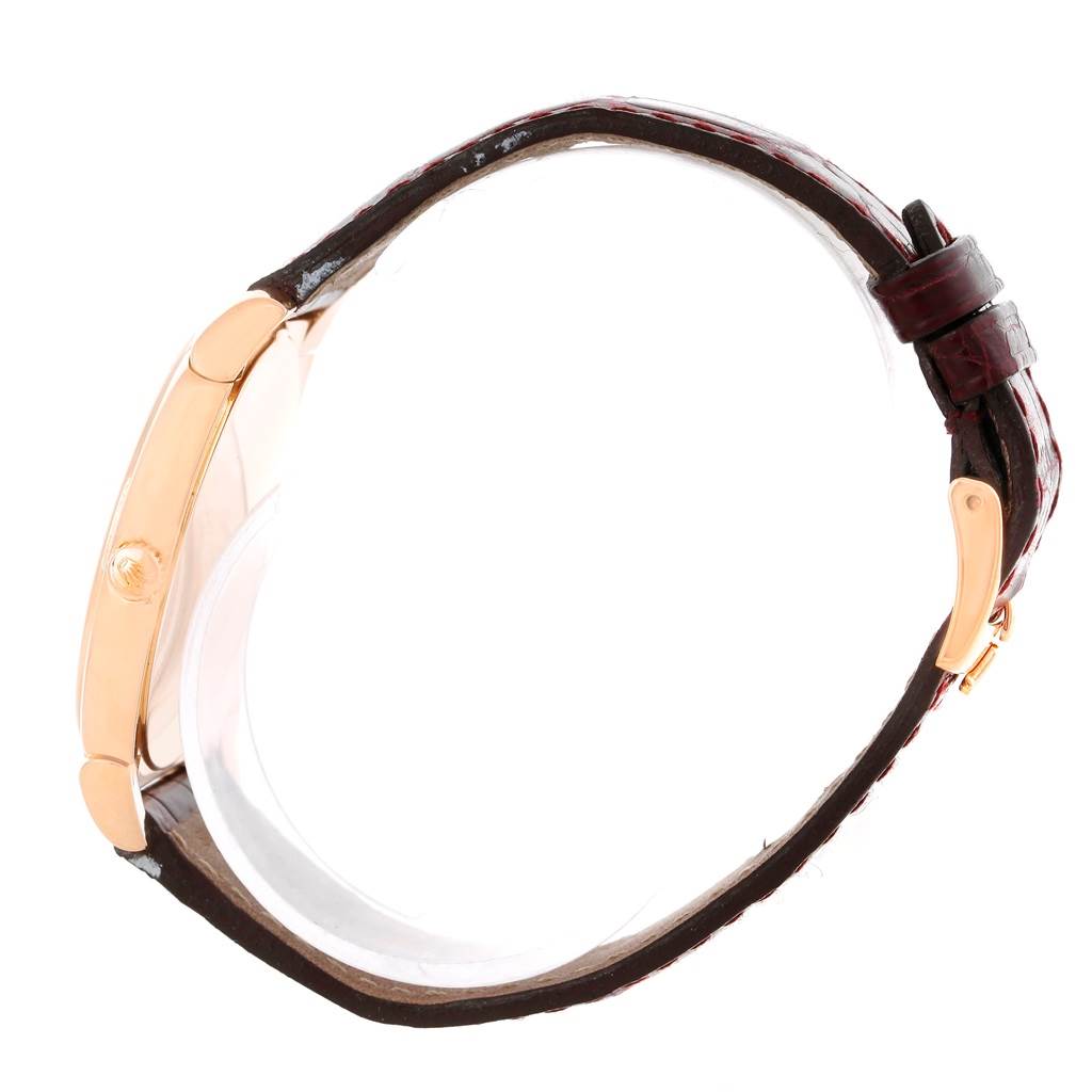 The image shows a side profile of a Rolex Cellini 5330 Men's Rose Gold White Dial 5330 Men's Rose Gold White Dial watch, highlighting its leather strap, gold case, and winding crown.