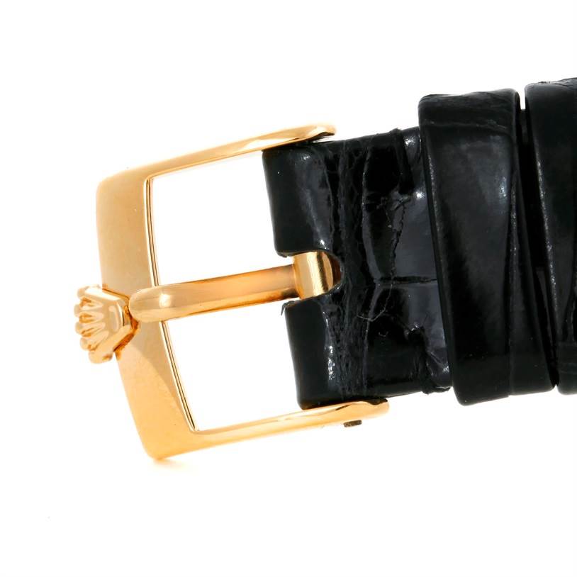 This image shows a close-up of the gold clasp and black leather strap of a Rolex Cellini 5112 Men's Yellow Gold Mother of Pearl Dial 5112 Men's Yellow Gold Mother of Pearl Dial watch.