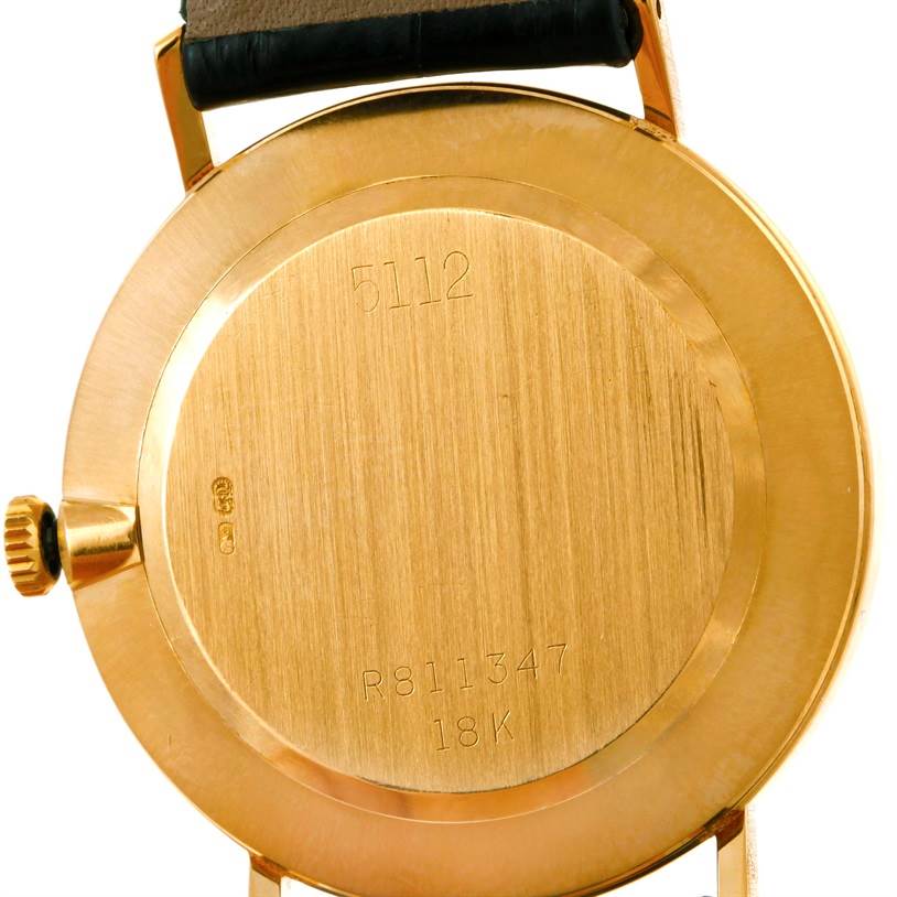 This image shows the back case and crown of a Rolex Cellini 5112 Men's Yellow Gold Mother of Pearl Dial 5112 Men's Yellow Gold Mother of Pearl Dial model watch.