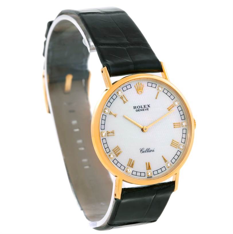 This image shows a Rolex Cellini 5112 Men's Yellow Gold Mother of Pearl Dial 5112 Men's Yellow Gold Mother of Pearl Dial watch at a slight side angle, highlighting its face, leather strap, and gold casing.