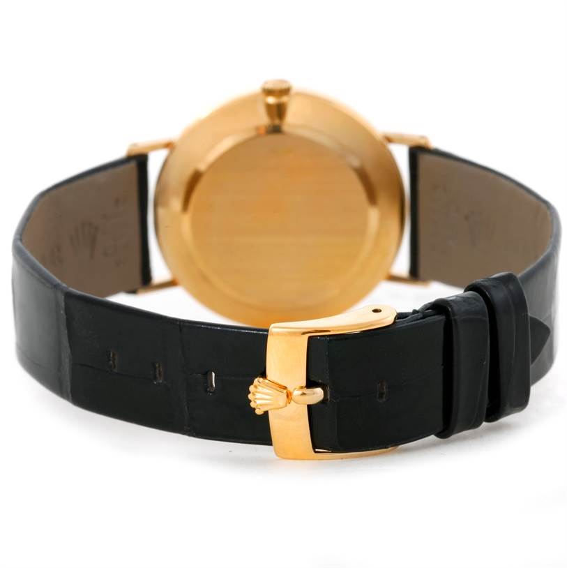 The image displays a rear view of a Rolex Cellini 5112 Men's Yellow Gold Mother of Pearl Dial 5112 Men's Yellow Gold Mother of Pearl Dial watch, focusing on the black leather strap and gold clasp.