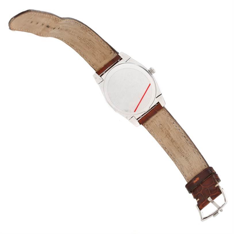 This image shows the back of a Rolex Cellini 5330 Men's White Gold Mother of Pearl Dial 5330 Men's White Gold Mother of Pearl Dial watch along with its brown leather strap.