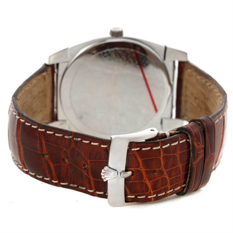 The image shows the back side of a Rolex Cellini 5330 Men's White Gold Mother of Pearl Dial 5330 Men's White Gold Mother of Pearl Dial watch featuring its leather strap and buckle.