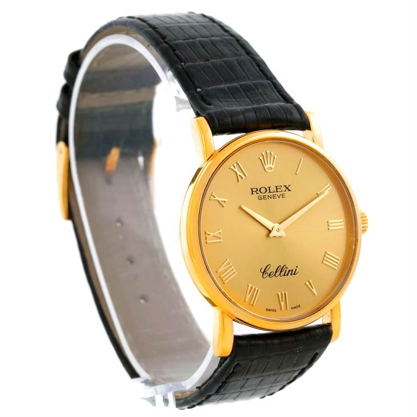 This image shows a side angle of a Rolex Cellini 5115 Men
s Yellow Gold Champagne Dial 5115 Men
s Yellow Gold Champagne Dial model watch, highlighting its gold case, roman numeral dial, and black leather strap.