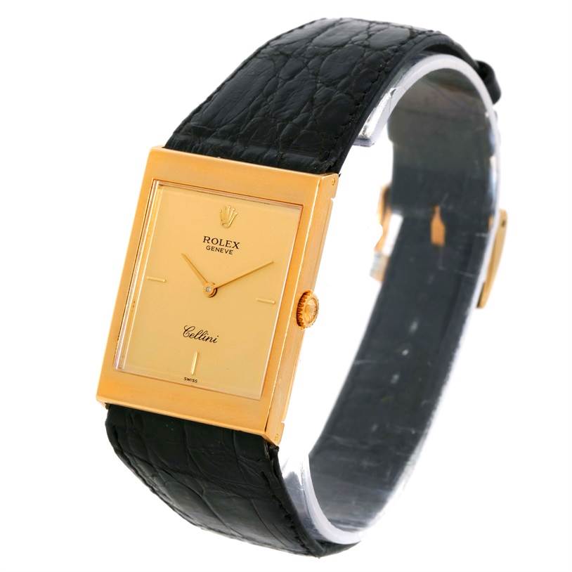 The image shows a Rolex Cellini 5071 Men's Yellow Gold Champagne Dial 5071 Men's Yellow Gold Champagne Dial watch at an angle showcasing its face, gold case, crown, and black leather strap.