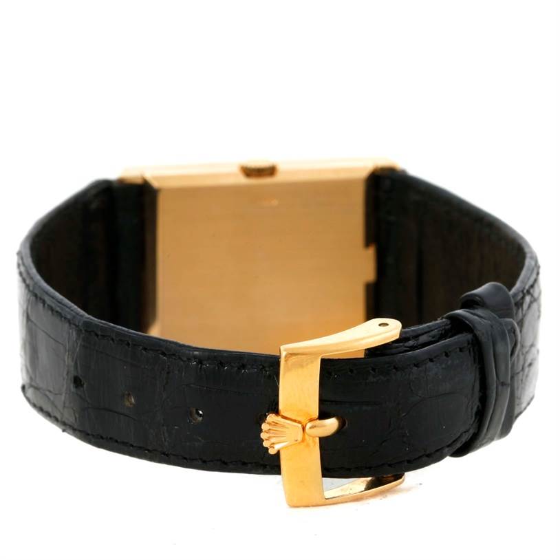 The image shows the back view of a Rolex Cellini 5071 Men's Yellow Gold Champagne Dial 5071 Men's Yellow Gold Champagne Dial watch, featuring its black leather strap and gold clasp.