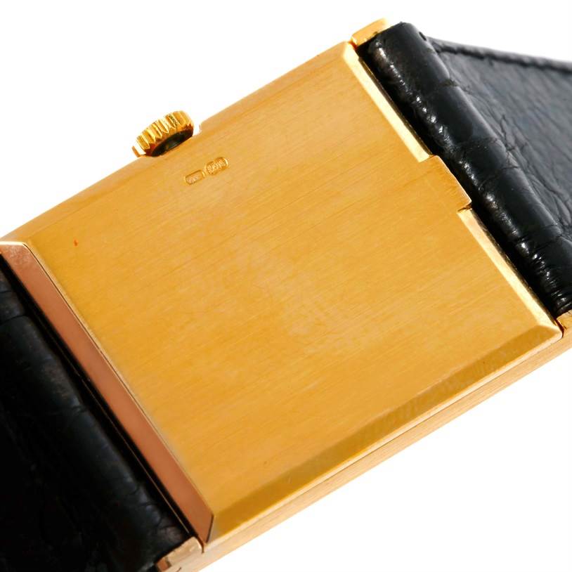 This image shows the back of a Rolex Cellini 5071 Men's Yellow Gold Champagne Dial 5071 Men's Yellow Gold Champagne Dial watch with a gold case and black leather strap.