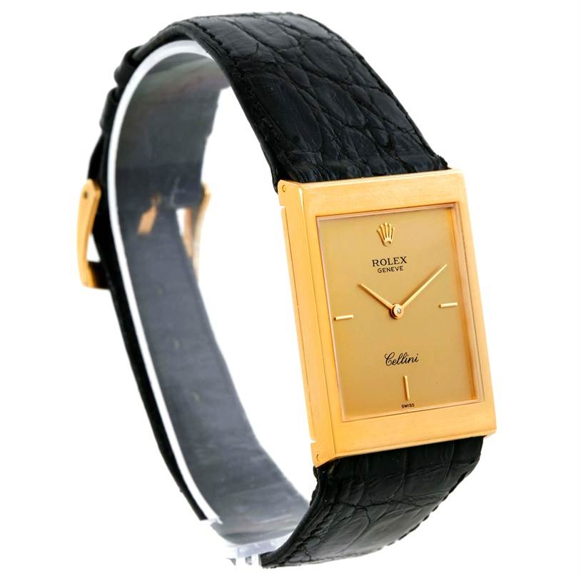 The image shows a Rolex Cellini 5071 Men's Yellow Gold Champagne Dial 5071 Men's Yellow Gold Champagne Dial watch from a three-quarter angle, displaying its rectangular gold case, dial, and black leather strap.