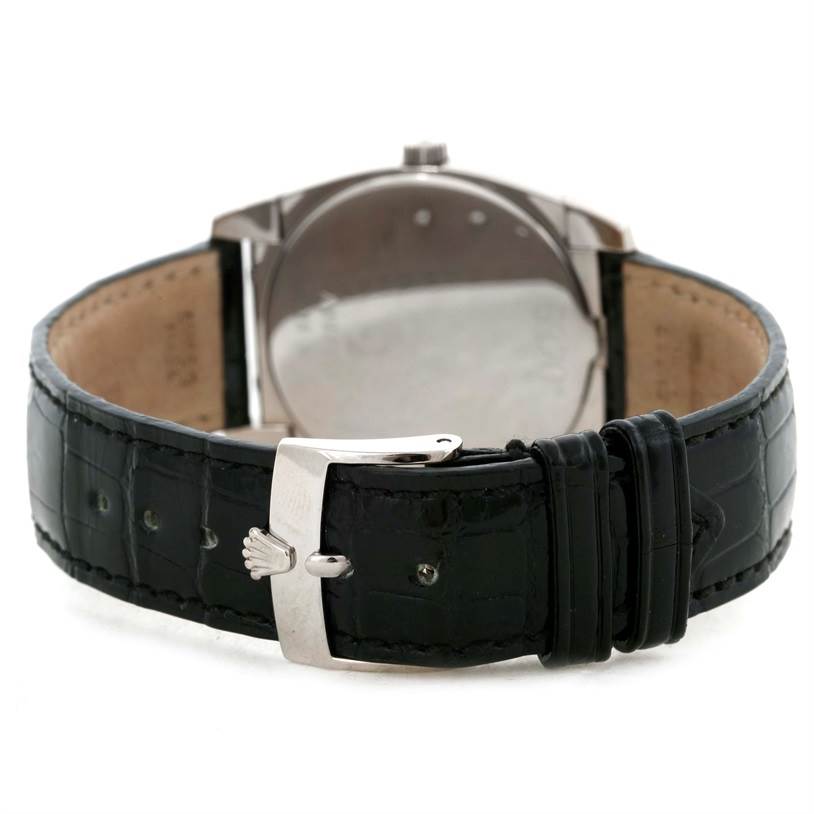 The image shows the back of a Rolex Cellini 5320 White Gold Mother of Pearl Dial 5320 White Gold Mother of Pearl Dial watch along with its black leather strap and buckle.