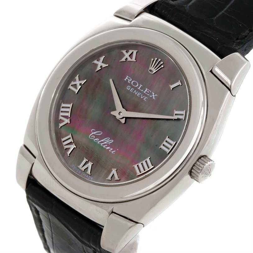 This image shows a close-up of the face of a Rolex Cellini 5320 White Gold Mother of Pearl Dial 5320 White Gold Mother of Pearl Dial watch, featuring its Roman numeral markers and leather strap.