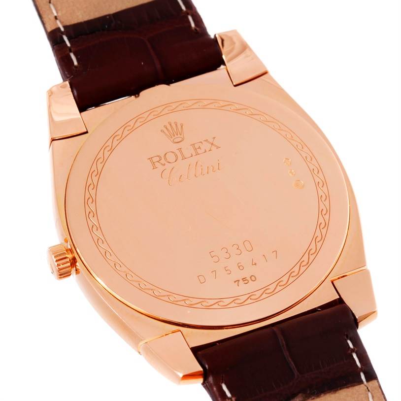 The image shows the back of the Rolex Cellini 5330 Men's Rose Gold Grey Dial 5330 Men's Rose Gold Grey Dial watch, featuring its engraved case back and part of the strap.