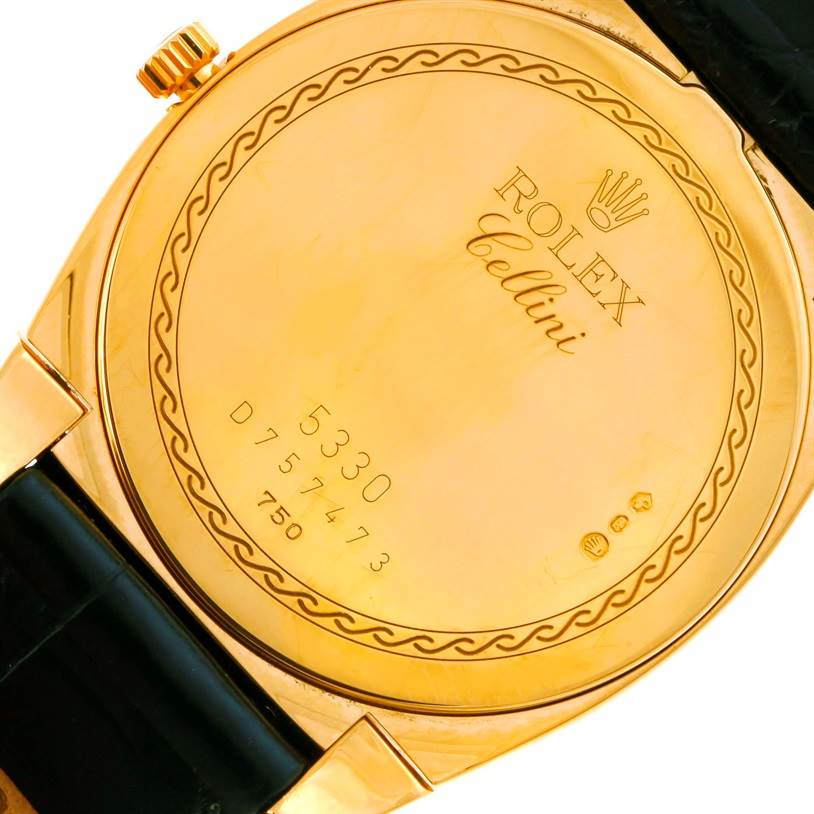 This image shows the back case of a Rolex Cellini 5330 Men's Yellow Gold White Dial 5330 Men's Yellow Gold White Dial watch along with part of the strap and crown at a slight angle.
