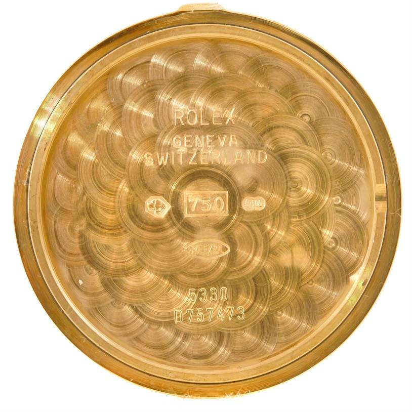 This is an image of the inside case back of a Rolex Cellini 5330 Men's Yellow Gold White Dial 5330 Men's Yellow Gold White Dial watch, showing model and serial numbers. 