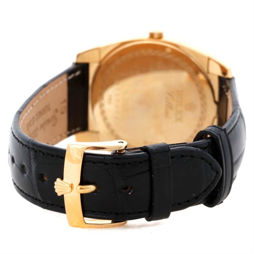 The image shows the back view of a Rolex Cellini 5330 Men's Yellow Gold White Dial 5330 Men's Yellow Gold White Dial watch, focusing on the black leather strap and the gold buckle.
