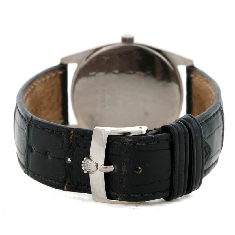 The image shows the back view of a Rolex Cellini 4233 Men's White Gold White Dial 4233 Men's White Gold White Dial watch, focusing on its black leather strap and silver buckle.