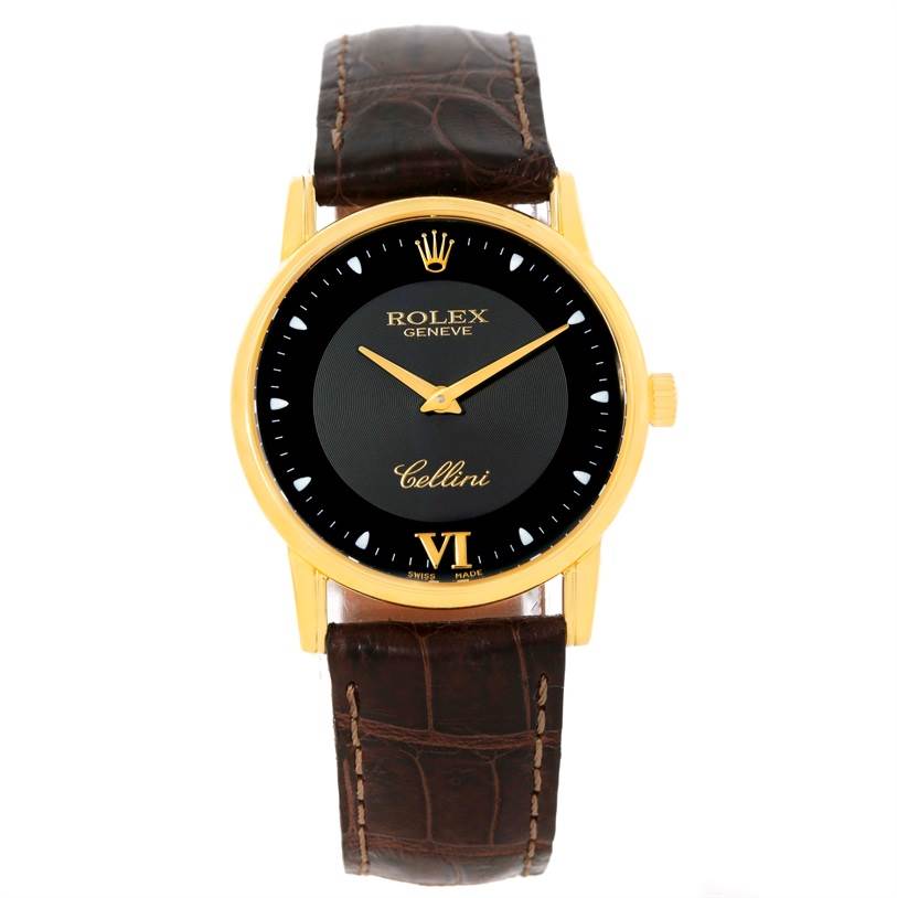 The image shows a frontal view of the Rolex Cellini 5116 Men
s Yellow Gold Black Dial 5116 Men
s Yellow Gold Black Dial watch, featuring its black dial, gold case, and brown leather strap.