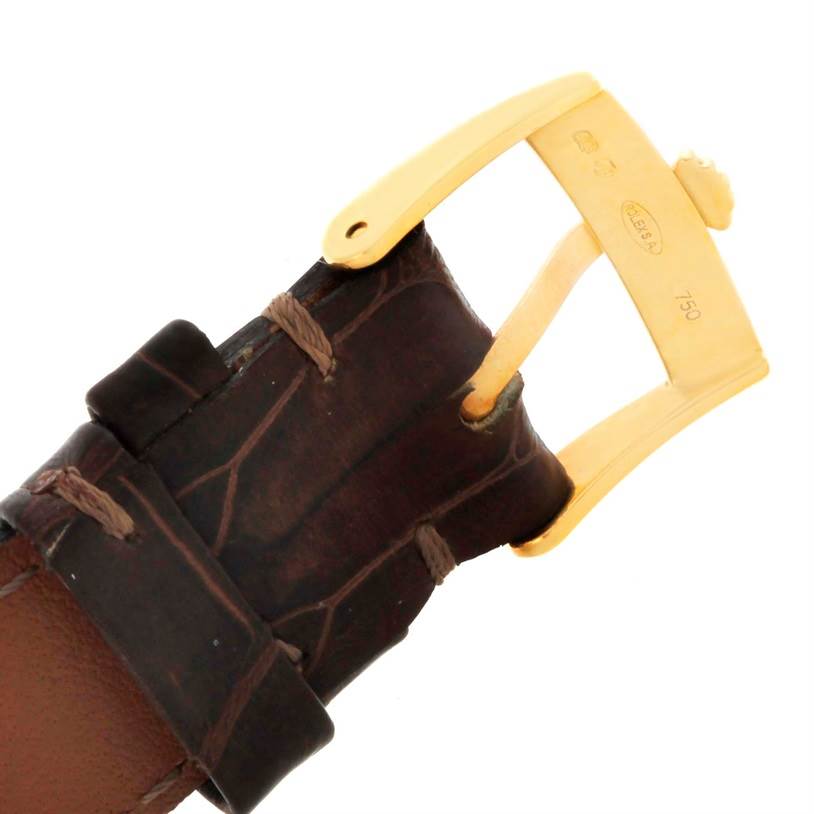 The image shows a close-up angle of the strap and gold buckle of a Rolex Cellini 5116 Men
s Yellow Gold Black Dial 5116 Men
s Yellow Gold Black Dial watch.