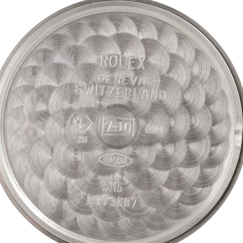 This image shows the inner case back of a Rolex Cellini 5115 Men's White Gold Black Dial 5115 Men's White Gold Black Dial watch, displaying engravings and hallmarks.