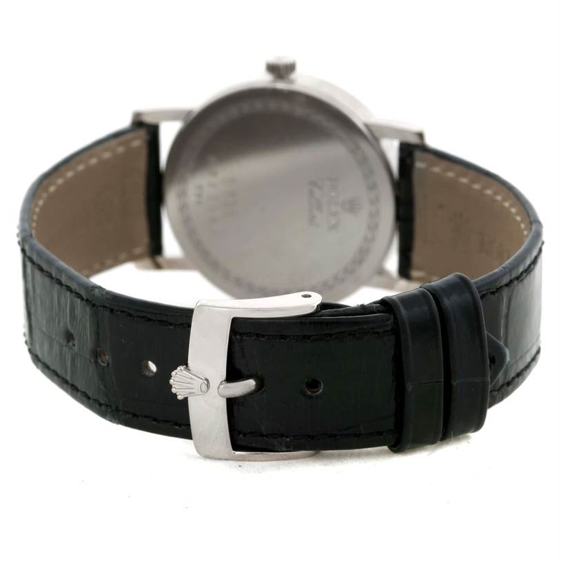 The image shows the rear view of a Rolex Cellini 5115 Men's White Gold Black Dial 5115 Men's White Gold Black Dial watch, highlighting the case back and black leather strap with a Rolex clasp.