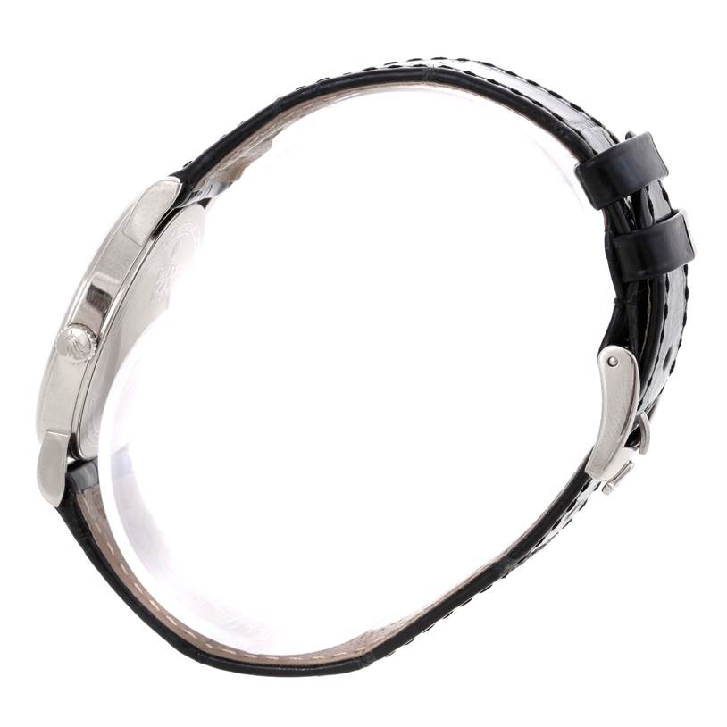 This side profile image of the Rolex Cellini 5115 Men's White Gold Black Dial 5115 Men's White Gold Black Dial watch shows the case, crown, and leather strap with buckle.