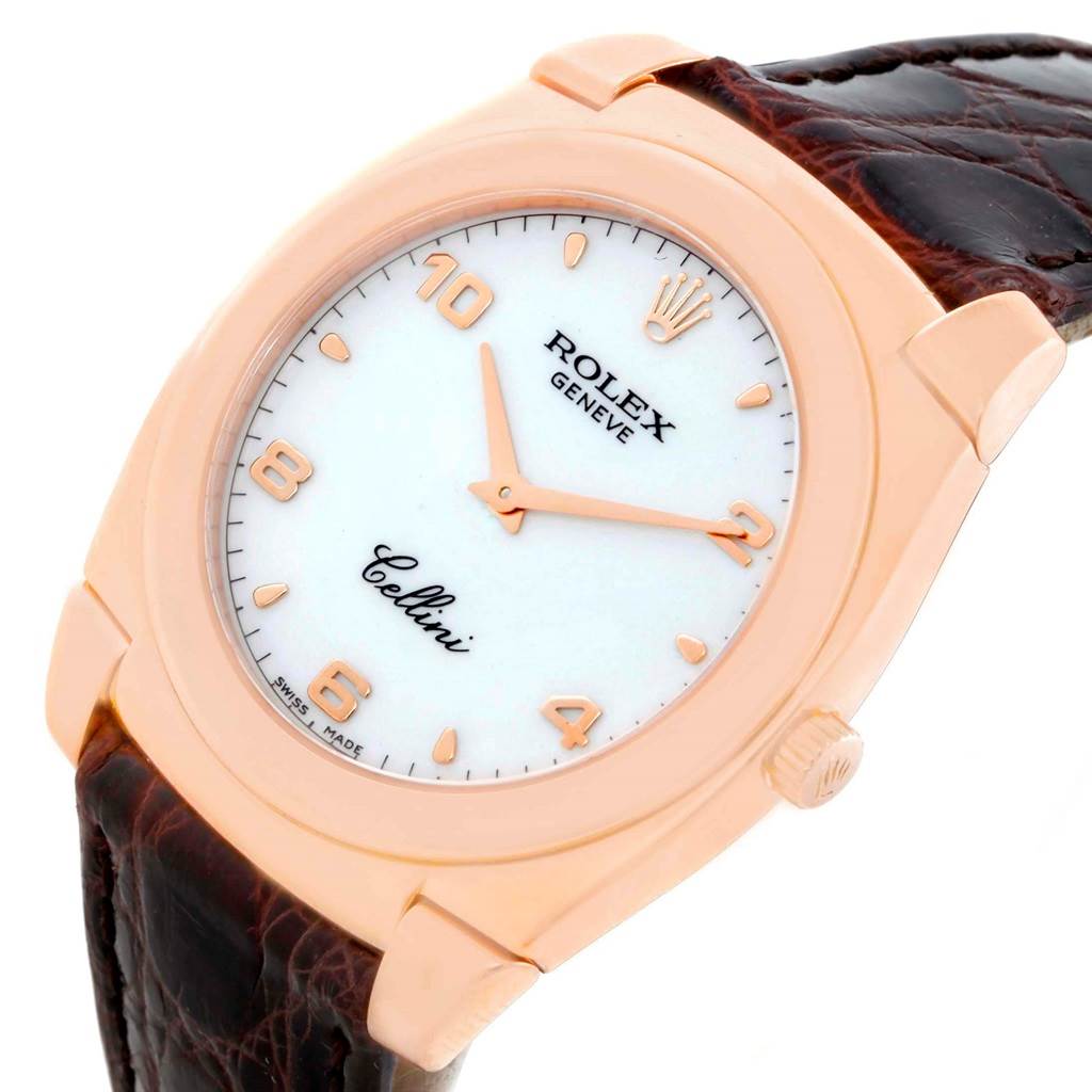 The Rolex Cellini 5330 Men's Rose Gold White Dial 5330 Men's Rose Gold White Dial watch is shown from an angled close-up, highlighting its face, crown, and part of the leather strap.