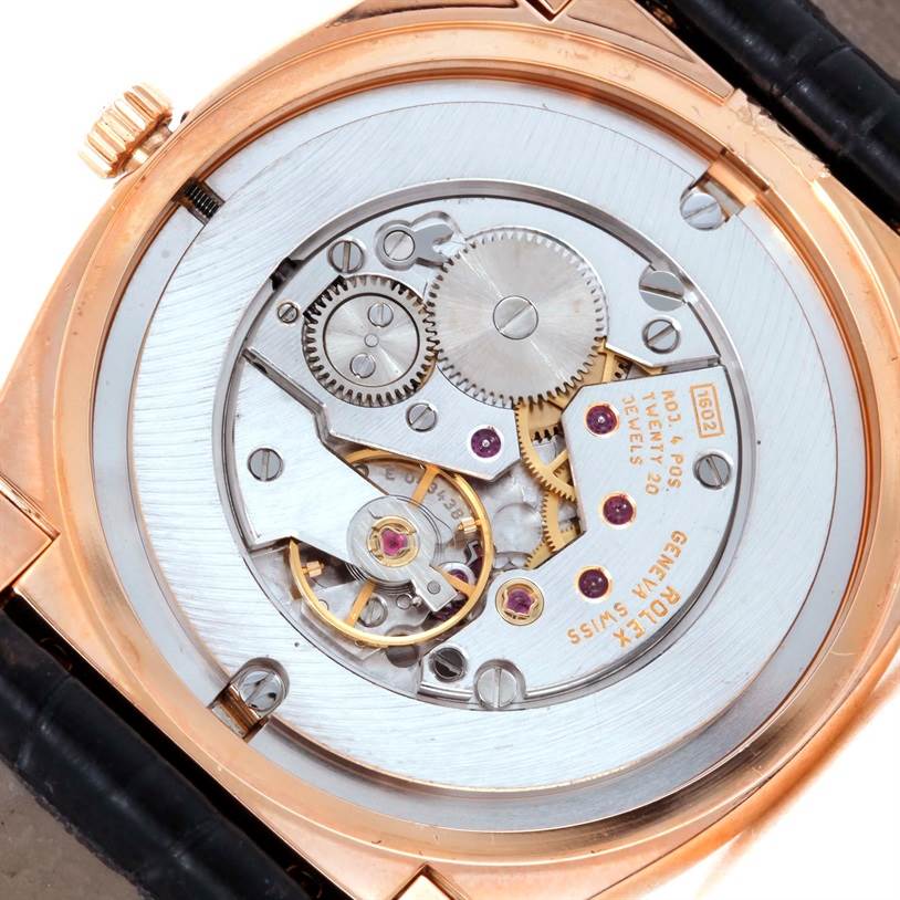 The image shows the back view of the Rolex Cellini 5330 Men's Rose Gold Grey Dial 5330 Men's Rose Gold Grey Dial model, highlighting its exposed movement and intricate mechanical parts.