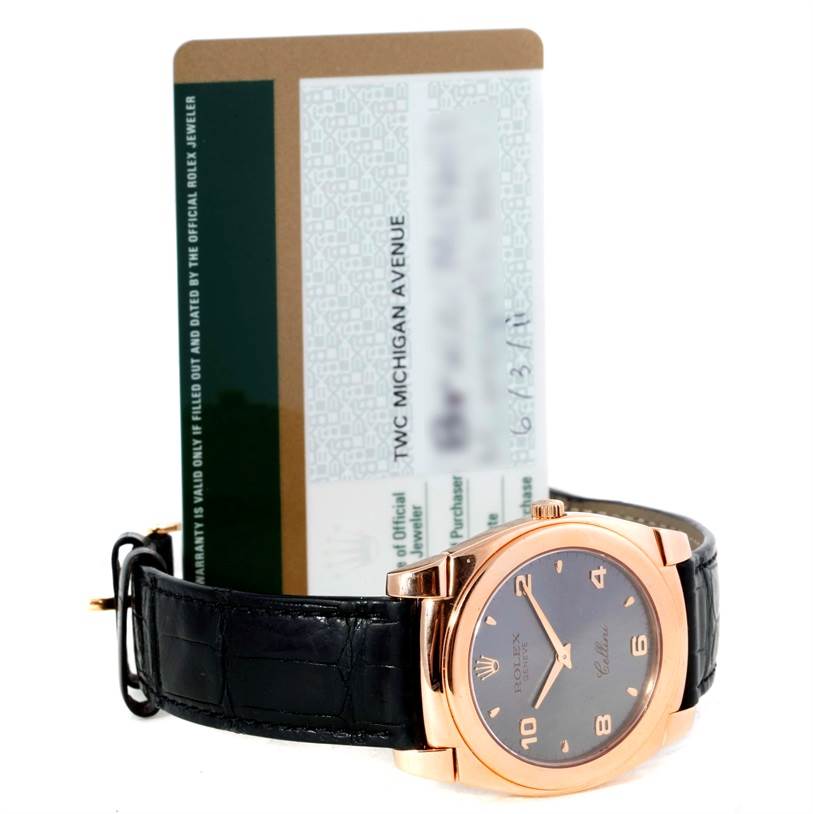 This image shows a frontal view of a Rolex Cellini 5330 Men's Rose Gold Grey Dial 5330 Men's Rose Gold Grey Dial watch with its certificate card in the background.
