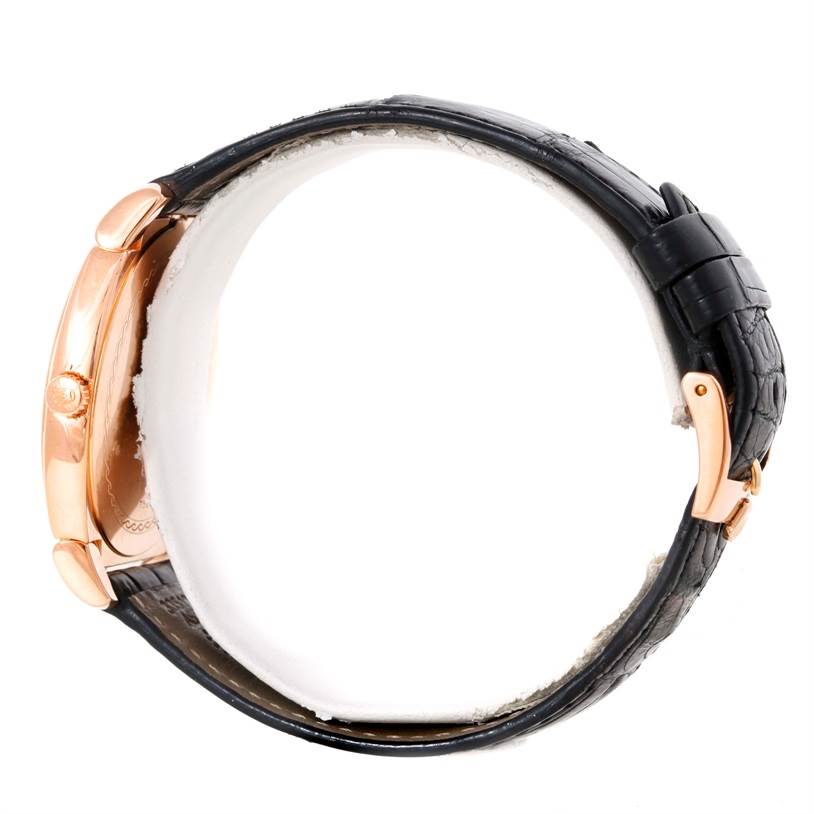 The image shows the side view of a Rolex Cellini 5330 Men's Rose Gold Grey Dial 5330 Men's Rose Gold Grey Dial watch, highlighting its case, crown, and leather strap with a clasp.