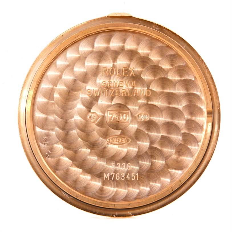 The image shows the inside of the case back of a Rolex Cellini 5330 Men's Rose Gold Grey Dial 5330 Men's Rose Gold Grey Dial watch, featuring engraved text and hallmarks.