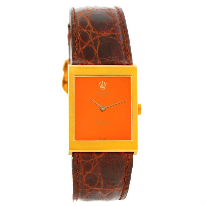 The image shows a front view of a Rolex Cellini 4014 Men's Yellow Gold Orange Dial 4014 Men's Yellow Gold Orange Dial watch with an orange dial and a brown leather strap.