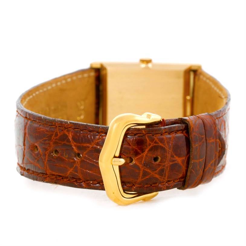 The image shows the back of the Rolex Cellini 4014 Men's Yellow Gold Orange Dial 4014 Men's Yellow Gold Orange Dial watch, focusing on its brown leather strap and gold buckle.