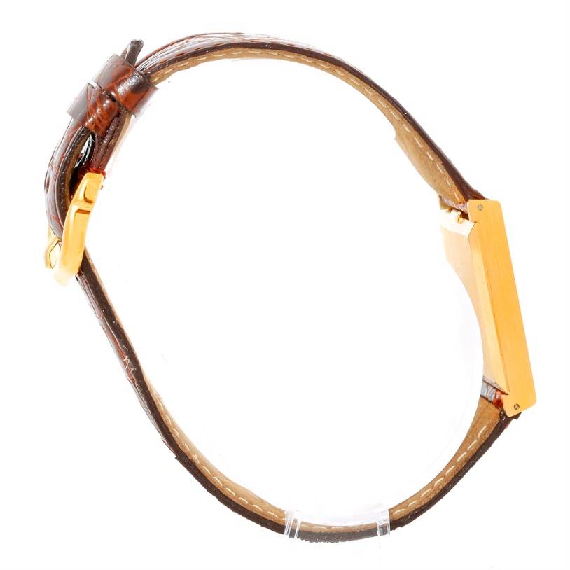 This image shows a side view of the Rolex Cellini 4014 Men's Yellow Gold Orange Dial 4014 Men's Yellow Gold Orange Dial watch, displaying the case, strap, and buckle.