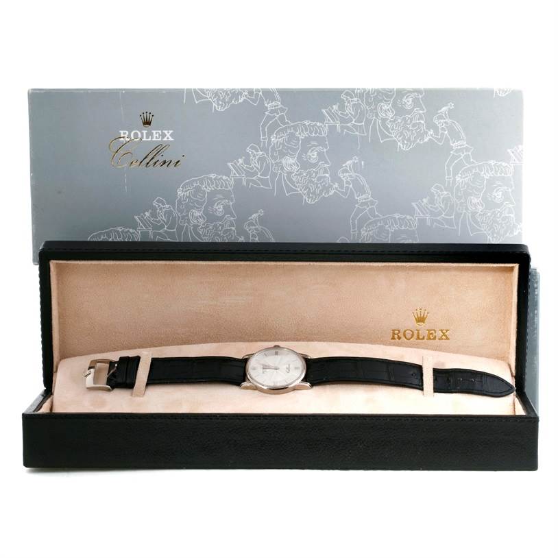 The image shows a Rolex Cellini 5116 Men's White Gold Silver Dial 5116 Men's White Gold Silver Dial watch in its open box, displaying the dial, strap, and clasp from a front view.