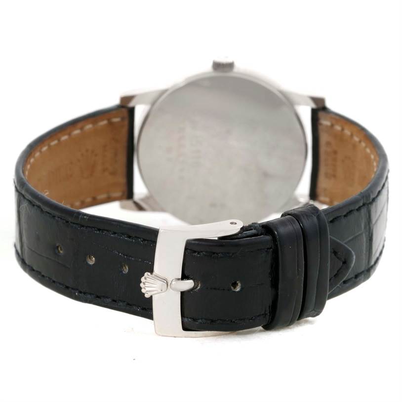 This image shows the back view of the Rolex Cellini 5116 Men's White Gold Silver Dial 5116 Men's White Gold Silver Dial watch, highlighting its leather strap and buckle.