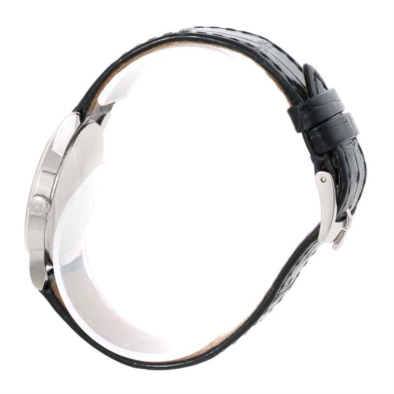 This image shows a Rolex Cellini 5116 Men's White Gold Silver Dial 5116 Men's White Gold Silver Dial watch from a side angle, highlighting the watch case, crown, and black leather strap with buckle.