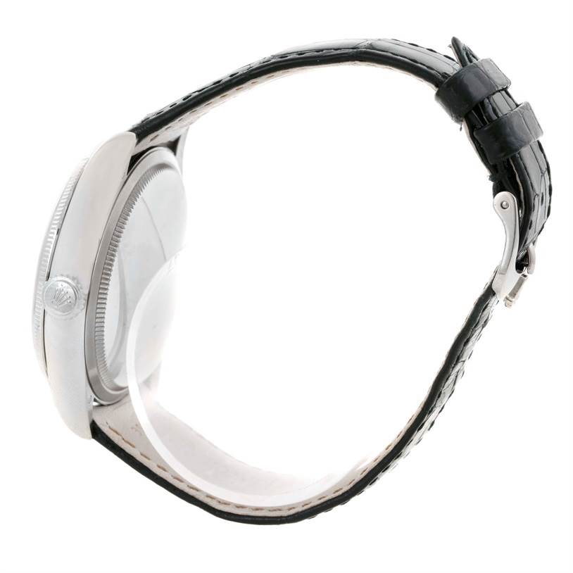 This image shows a side view of a Rolex Cellini 50529 Men's White Gold Silver Dial 50529 Men's White Gold Silver Dial watch, displaying the case, crown, and leather strap.