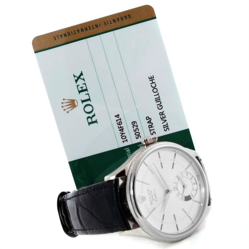 The image shows a side angle of the Rolex Cellini 50529 Men's White Gold Silver Dial 50529 Men's White Gold Silver Dial watch with a silver dial and black leather strap, and an authenticity card behind it.