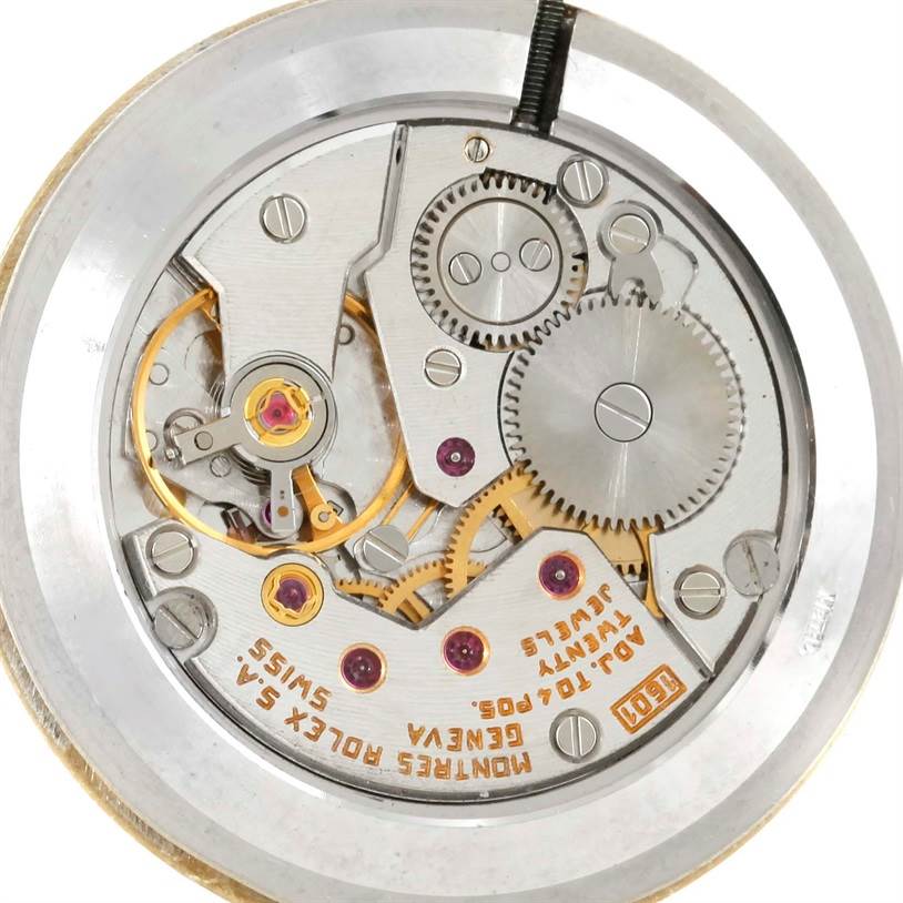 This image shows the intricate inner mechanical movement of the Rolex Cellini 4112 Men
s Yellow Gold Champagne Dial 4112 Men
s Yellow Gold Champagne Dial watch from a top-down angle.
