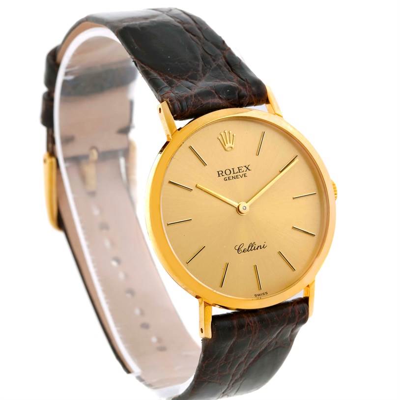 The image shows a Rolex Cellini 4112 Men
s Yellow Gold Champagne Dial 4112 Men
s Yellow Gold Champagne Dial watch angled to display its gold dial, case, and leather strap.