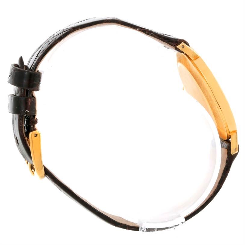 The image shows a side view of a Rolex Cellini 4112 Men
s Yellow Gold Champagne Dial 4112 Men
s Yellow Gold Champagne Dial watch, highlighting the strap and watch case.