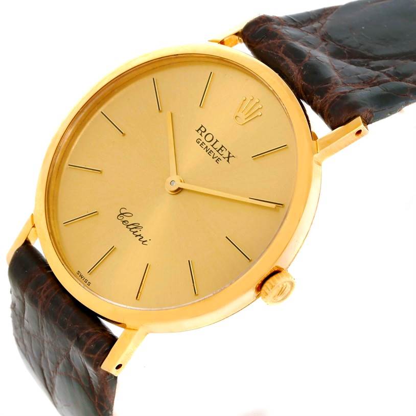 The Rolex Cellini 4112 Men
s Yellow Gold Champagne Dial 4112 Men
s Yellow Gold Champagne Dial watch is shown at an oblique angle, highlighting the dial, crown, and part of the leather strap.